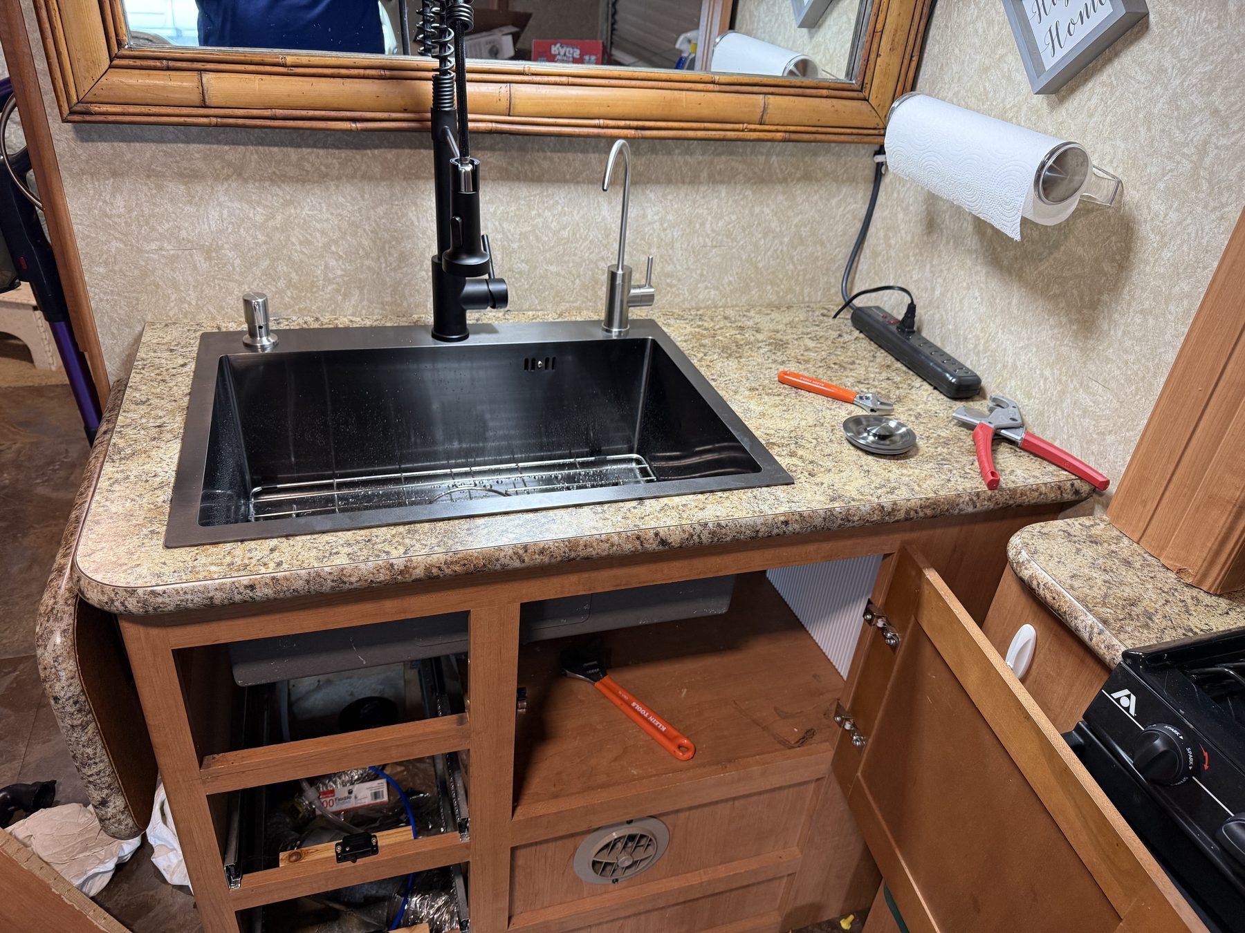 RV sink and cabinet repair in kitchen area